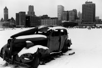 City snowscape with junk car