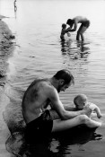 Man and child in lake water, Lake Nikomis, Mpls, 1963